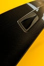 Close up of black car handle in yellow luxury porshe in car showroom Royalty Free Stock Photo