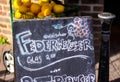 Close up of black chalk board with Federweisser meaning fermented freshly pressed grape juice wine, Germany