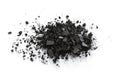 Close-up of black charcoal dust scattered on isolated transparent background. Irregularly shaped pieces create random texture. Royalty Free Stock Photo