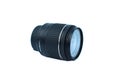 Close up of a black color camera lens of a digital camera placed over a white background Royalty Free Stock Photo