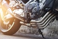 Modern motorcycle and exhaust details on street background Royalty Free Stock Photo