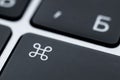 Close-up of a black command key on a keyboard. Function key to control