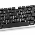 Close-up of Black Computer Keyboard on White Surface Technology Royalty Free Stock Photo