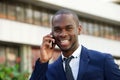 Close up black corporate businessman talking with phone in city Royalty Free Stock Photo