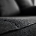 A close up of a black couch with a black and white background Royalty Free Stock Photo
