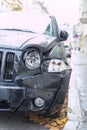 Damaged car, accident. Deformation of the front of a black car Royalty Free Stock Photo