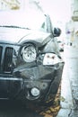 Damaged car, accident. Deformation of the front of a black car Royalty Free Stock Photo