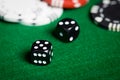 Close up of black dices on green casino table Royalty Free Stock Photo