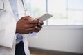 Close up of Black doctor entering patient information into digital tablet