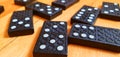 A close up of black domino bricks on a wooden floor Royalty Free Stock Photo