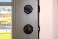 Close up of black door knob and unlocked latch