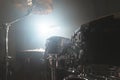 Close-up black drums A modern drum set prepared for playing in a dark rehearsal room on stage with a bright spotlight Royalty Free Stock Photo