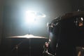 Close-up black drums A modern drum set prepared for playing in a dark rehearsal room on stage with a bright spotlight Royalty Free Stock Photo