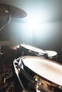 Close-up black drums A modern drum set prepared for playing in a dark rehearsal room on stage with a bright spotlight Royalty Free Stock Photo