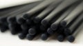 A close-up of black foam-tipped applicators on a light background Royalty Free Stock Photo