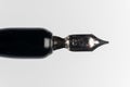 A close-up of a black fountain pen on a white background. Macro view of the pen tip. Royalty Free Stock Photo