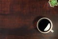 Close-up of Black fresh hot coffee espresso for morning drink breakfast with aroma in a white ceramic cup on rustic dark wood Royalty Free Stock Photo