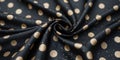 a close up of a black and gold dotted fabric Royalty Free Stock Photo