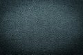 Close-up of black gray plastic material seamless texture. Surface of rough abstract dark black matte background.