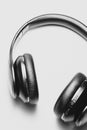 Close up of black headphones lying on a white table Royalty Free Stock Photo