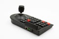 Close-up of a black joystick with buttons.