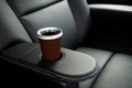 close-up of black leather recliner with cupholder