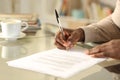 Black man hands singing contract on a desk Royalty Free Stock Photo