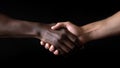 Close up of black man and woman shaking hands, on black background Royalty Free Stock Photo