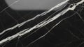 Close up of black marble surface with striking white and grey veining patterns and polished texture Keywords: black Royalty Free Stock Photo