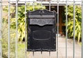 Close up Black Metal Post Box Hanging on Railings Royalty Free Stock Photo