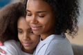 Close up of black mom hugging teenage daughter Royalty Free Stock Photo