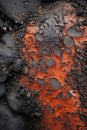 a close up of a black and orange lava rock