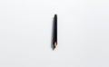 Close-up of black pen on white background. Royalty Free Stock Photo