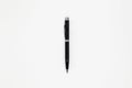 Close up of black pen on white background. Royalty Free Stock Photo