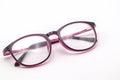 Close up black and pink eye glasses on white background. Royalty Free Stock Photo