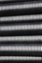 Close up of black plastic pipes with diminishing perspective Royalty Free Stock Photo