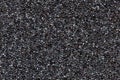 Close-up black polyurethane foam texture. Rainbow film flares. Abstract black cellular background