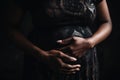 close up of black pregnant woman holding belly with hands Pregnancy, maternity, preparation and expectation concept. illustration