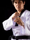 Close up Black Red Belt TaeKwonDo Karate male athlete man show traditional Fighting poses