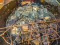 Close up Black stinky tofu Frying in the pan at fenghuang old town China.