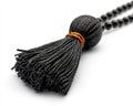 Elegant Black Tassel with Copper Accent on White Royalty Free Stock Photo