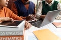 Close Up of Black Teacher Using Laptop at Desk Royalty Free Stock Photo