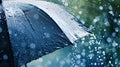 Close up, black umbrella under rainfall against a background of water droplets splashing. Concept of rainy weather. Royalty Free Stock Photo