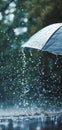 Close up, black umbrella under rainfall against a background of water droplets splashing. Concept of rainy weather. Royalty Free Stock Photo