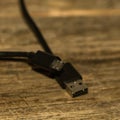 Close up of black USB cable isolated, cable USB connection Royalty Free Stock Photo