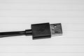 Close up of black USB cable isolated, cable USB connection Royalty Free Stock Photo