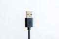 Close-up of black USB charger cable isolated on white background. Royalty Free Stock Photo