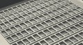 Close-up black and white grid pattern with small rectangular boxes featuring centered squares in a repeating textured design Royalty Free Stock Photo