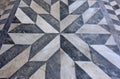 Geometric black and white marble floor with star-shaped pattern Royalty Free Stock Photo