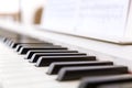 Close up of black and white piano keys.